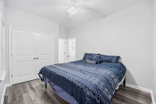 bedroom featuring hardwood / wood-style floors, ceiling fan, and a closet