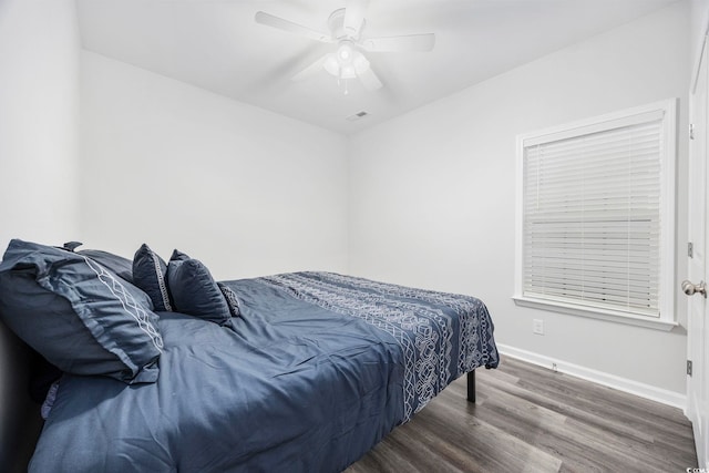 bedroom with ceiling fan and hardwood / wood-style floors