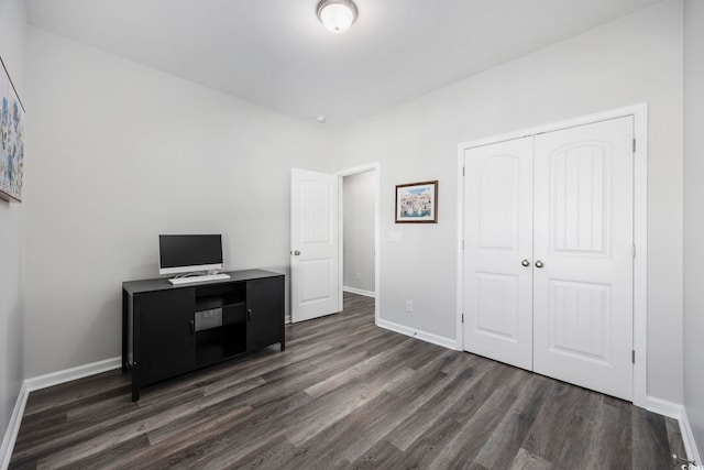 unfurnished office featuring dark hardwood / wood-style floors