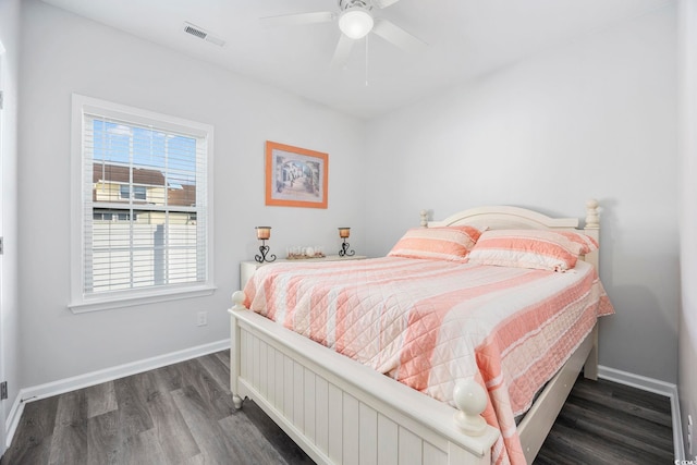 bedroom featuring ceiling fan and dark hardwood / wood-style flooring