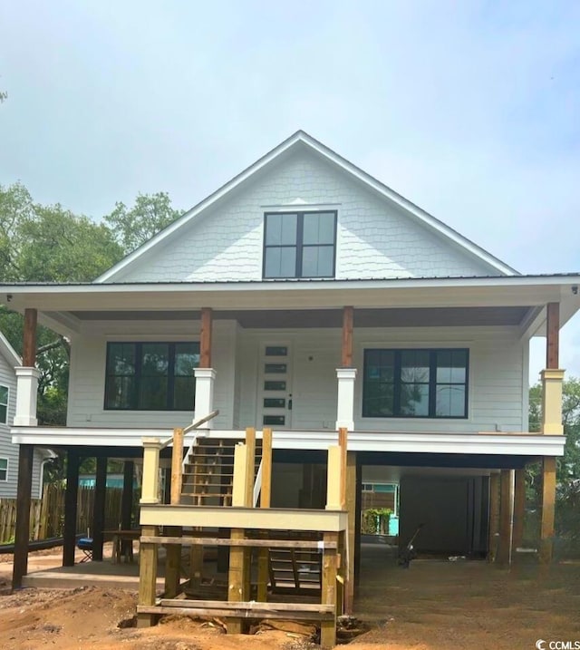 314 Hollywood Dr S, Surfside Beach, SC 29575 - view of front facade featuring covered porch and stairway