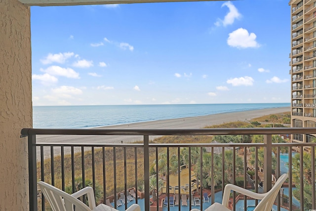 balcony with a view of the beach and a water view