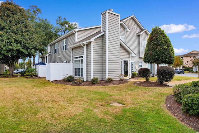 view of property exterior featuring a lawn