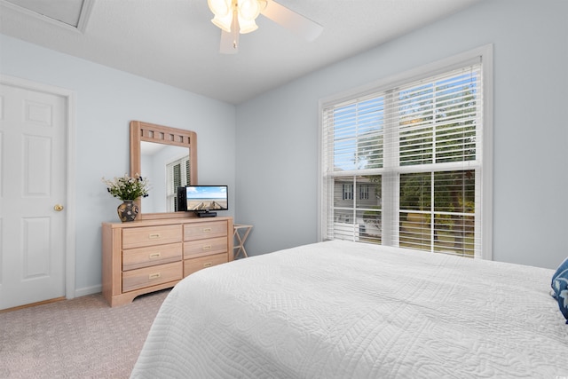 bedroom with light carpet and ceiling fan