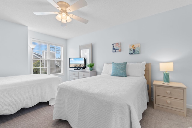 bedroom with ceiling fan and light colored carpet