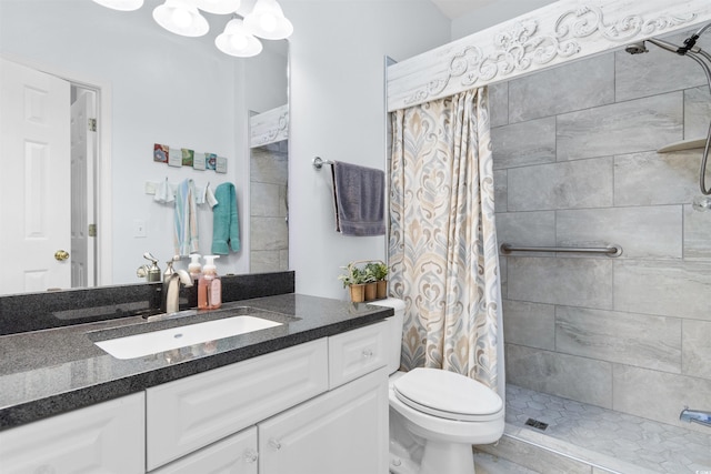 bathroom featuring toilet, vanity, and a shower with shower curtain