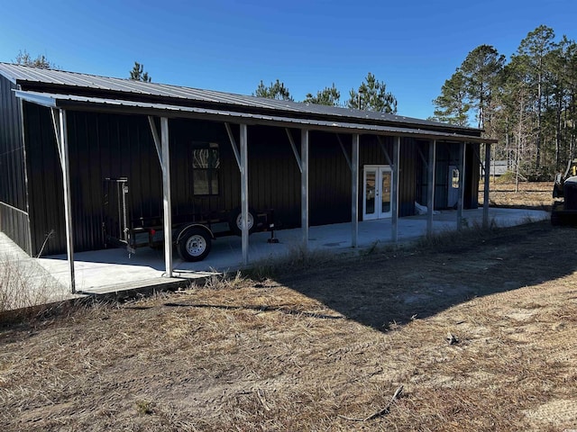 rear view of house featuring french doors