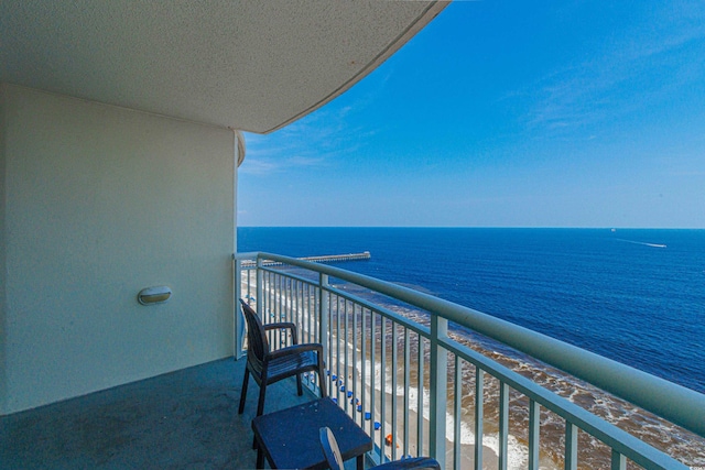 balcony featuring a water view