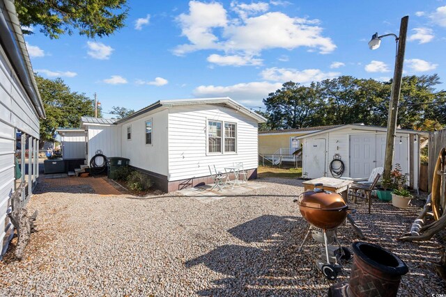 exterior space featuring a storage unit