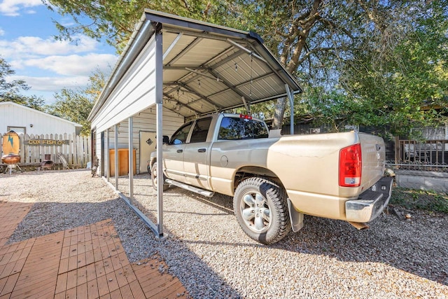 view of vehicle parking with a carport