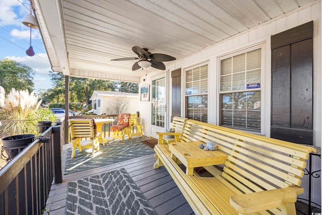 deck featuring ceiling fan and a porch