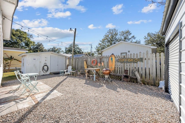 817 Wayne St, North Myrtle Beach, SC 29582 - fenced backyard with a patio area