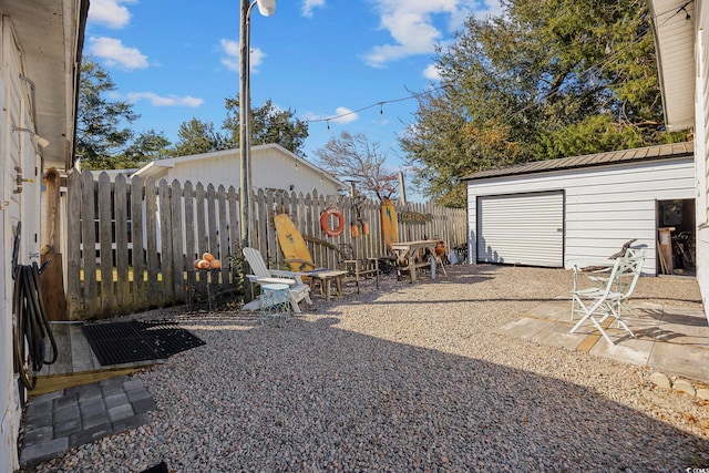 817 Wayne St, North Myrtle Beach, SC 29582 - fenced backyard with a patio and an outbuilding