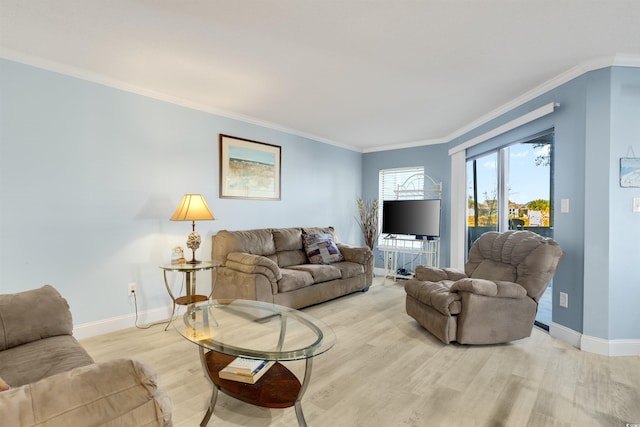 living room with light wood-type flooring and ornamental molding