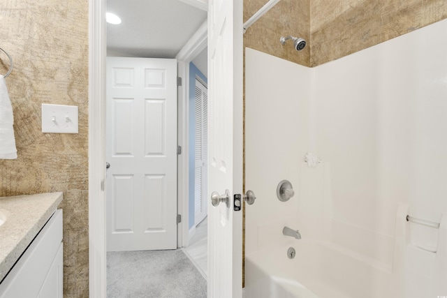 bathroom with vanity and  shower combination