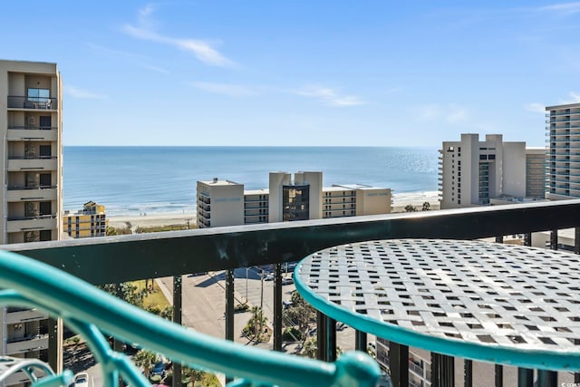 balcony with a view of the beach and a water view