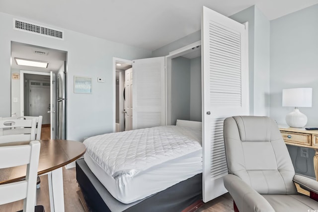 bedroom featuring hardwood / wood-style floors