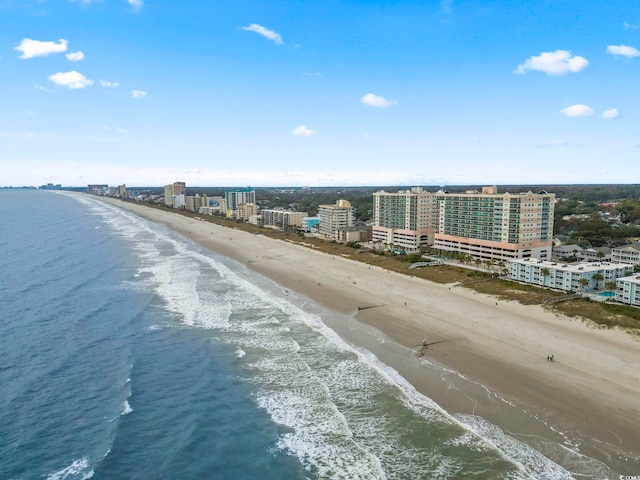 birds eye view of property featuring a water view and a view of the beach