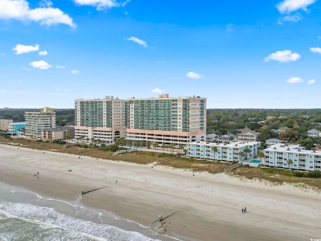 birds eye view of property featuring a water view and a view of the beach