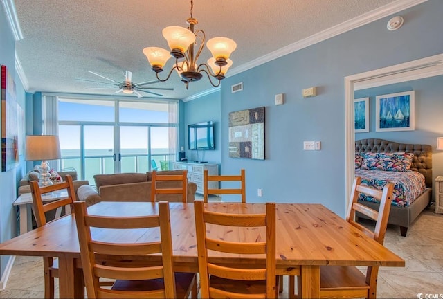 dining area featuring floor to ceiling windows, ceiling fan with notable chandelier, ornamental molding, a textured ceiling, and light tile patterned floors