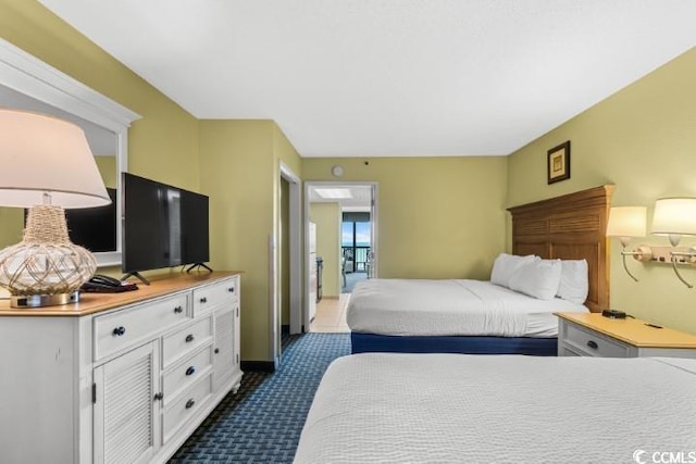 bedroom featuring dark colored carpet