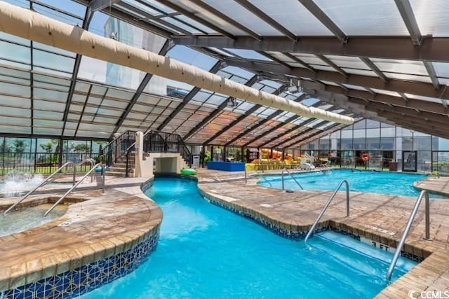 view of pool with pool water feature and a patio area