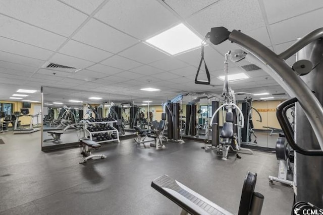 gym featuring a paneled ceiling