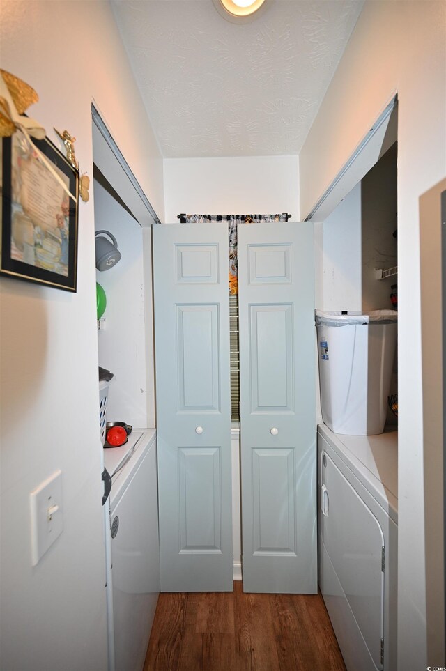 hallway featuring washer and dryer and dark hardwood / wood-style floors