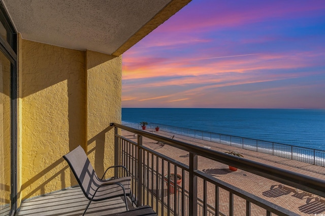 balcony at dusk with a water view