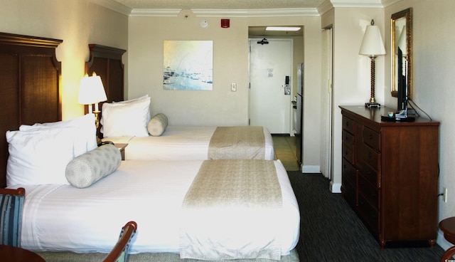 1200 N Ocean Blvd Unit 804, Myrtle Beach, SC 29577 - bedroom featuring dark colored carpet and crown molding