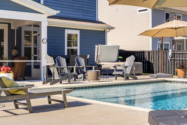 view of swimming pool featuring a patio area