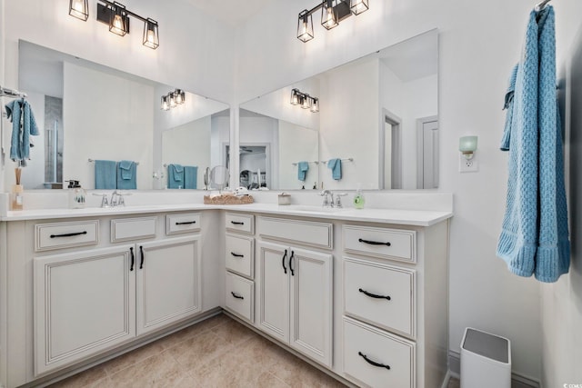 bathroom with tile patterned flooring and vanity