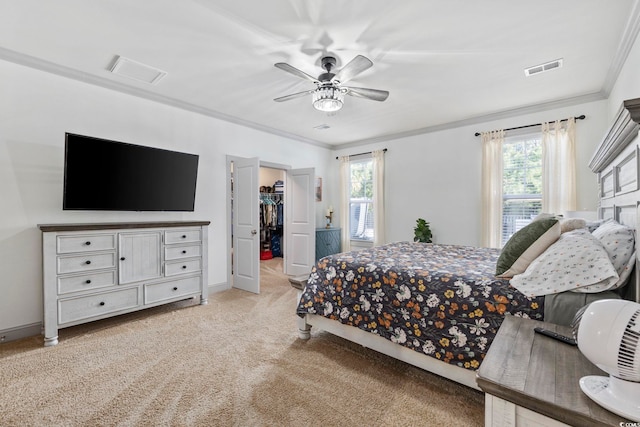 bedroom with multiple windows, a closet, a spacious closet, and ceiling fan