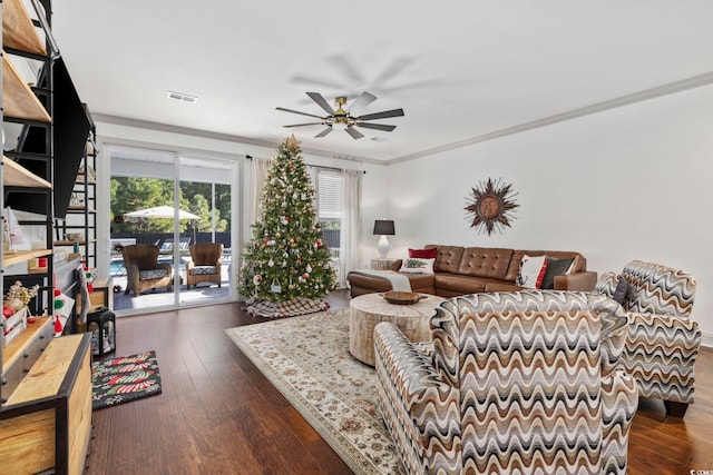 living room with ceiling fan, dark hardwood / wood-style flooring, and ornamental molding