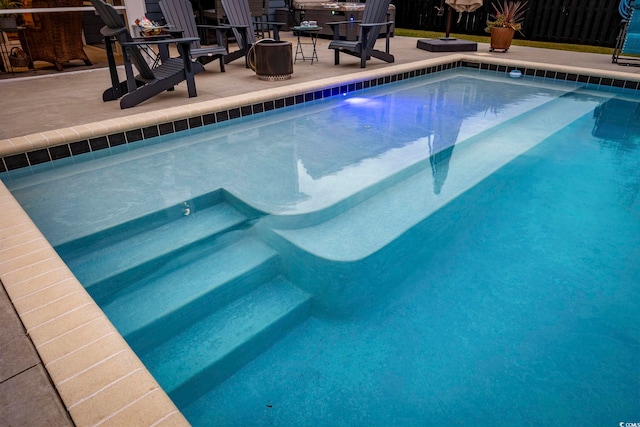 view of swimming pool featuring a patio