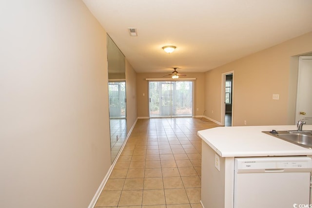 kitchen with ceiling fan, dishwasher, light tile patterned floors, and sink