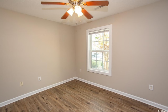 spare room featuring hardwood / wood-style floors