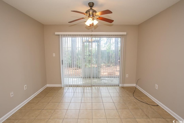 spare room featuring ceiling fan and light tile patterned floors