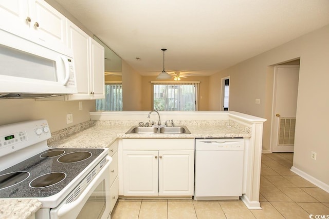 kitchen featuring white cabinetry, ceiling fan, sink, decorative light fixtures, and white appliances