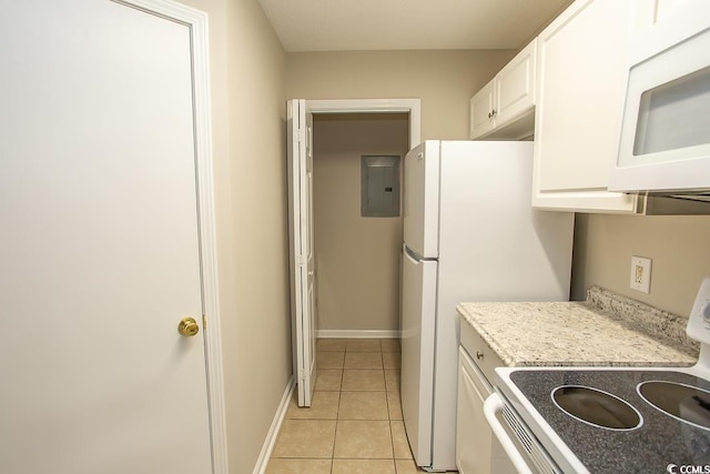 kitchen with stove, electric panel, light tile patterned floors, light stone counters, and white cabinetry