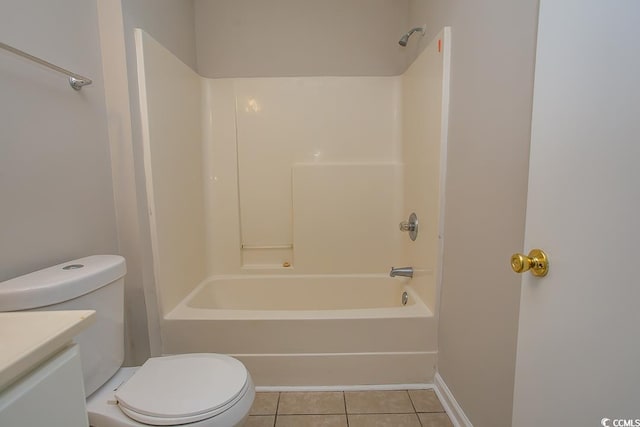 full bathroom featuring toilet, vanity, tile patterned floors, and shower / washtub combination