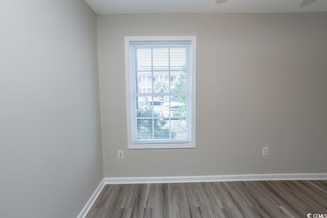 empty room featuring hardwood / wood-style floors and a textured ceiling