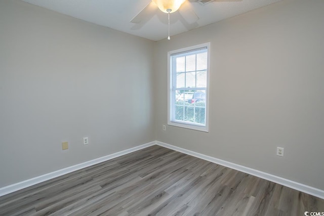 empty room featuring ceiling fan and wood-type flooring