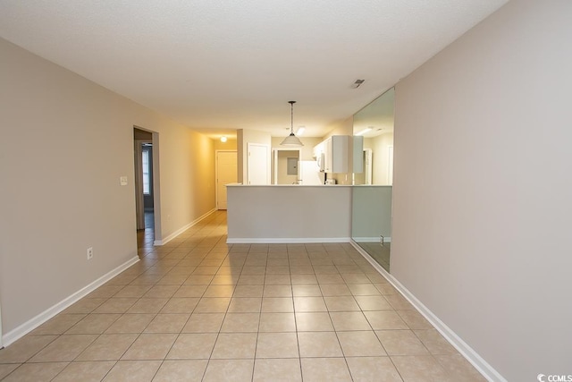 spare room with light tile patterned floors