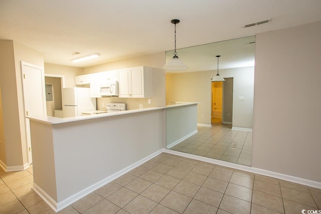 kitchen with kitchen peninsula, white appliances, light tile patterned floors, decorative light fixtures, and white cabinetry