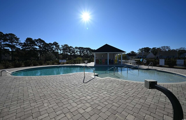 view of patio with a community pool