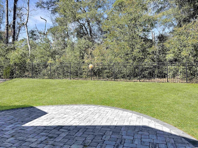 view of yard with a patio and fence