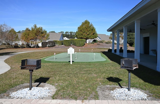 view of yard featuring a ceiling fan