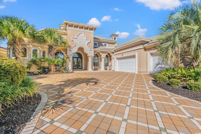 mediterranean / spanish-style house featuring a garage