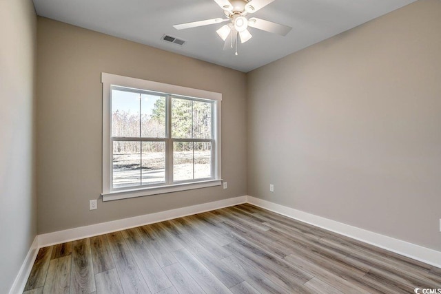 unfurnished room featuring ceiling fan and light hardwood / wood-style flooring